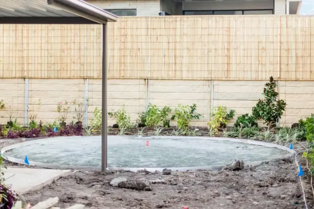 Concrete swimming pool removed and filled with compacted soil during pool demolition project in Balwyn North Victoria backyard.